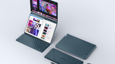 A photo of the Yoga Book 9i with all the accessories and the screen open in the vertical mode