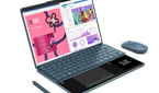 A photo of the Yoga Book 9i and the handwriting panel on the keyboard with mouse and pen accessories