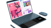A photo of the Yoga Book 9i and the handwriting panel on the keyboard with mouse and pen accessories