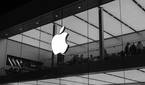 An image of the Apple logo on the outside of an Apple Store.