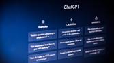 An angled photo of a screen showing ChatGPT's prompt and capabilities.