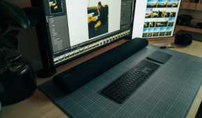 Samsung soundbar on a PC desk.