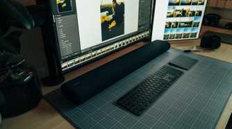 Samsung soundbar on a PC desk.