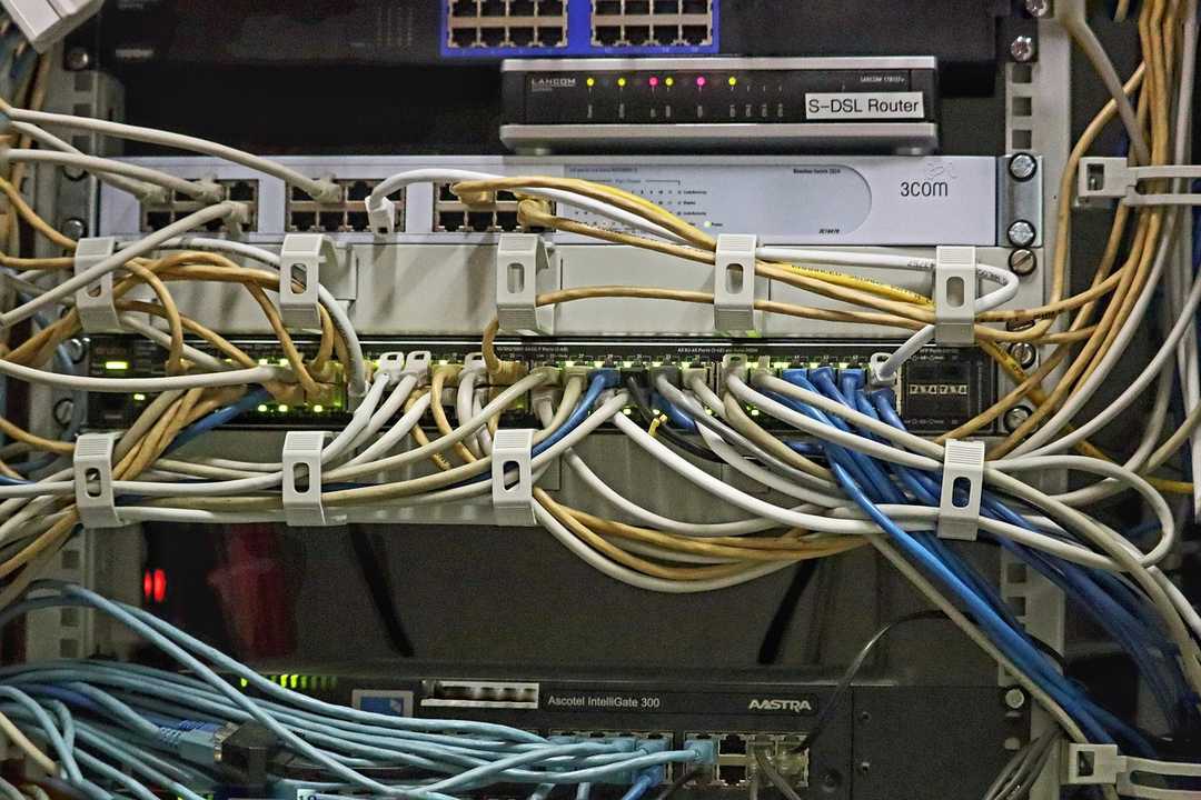 Image of switches and server with ethernet cables running