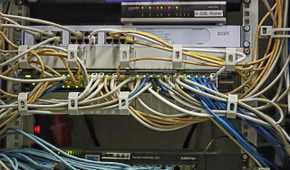 Image of switches and server with ethernet cables running