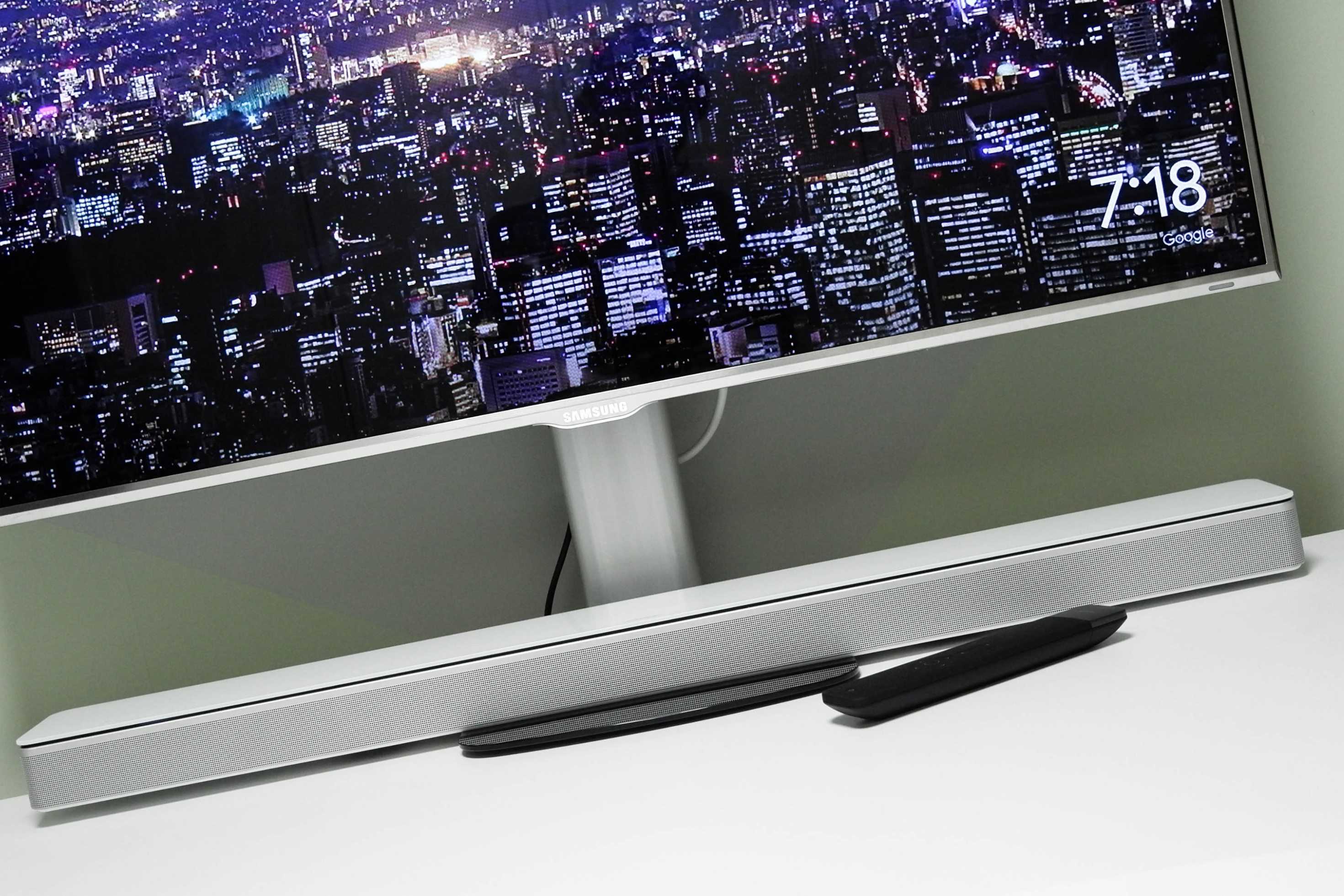 Soundbar under a PC monitor on a desk