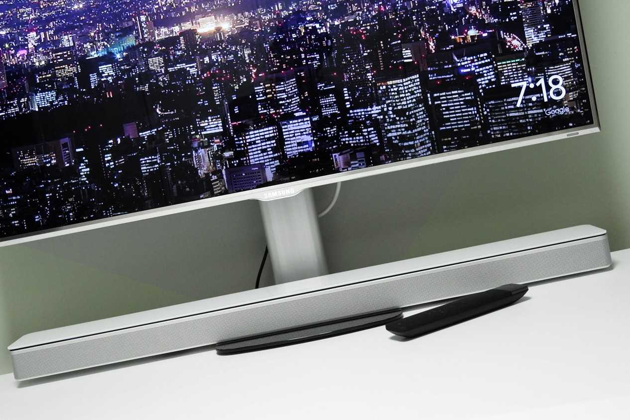Soundbar under a PC monitor on a desk