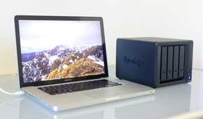 Photo of a MacBook Pro connected to a Synology NAS.