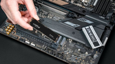 Crucial P3 Plus SSD being installed into a motherboard