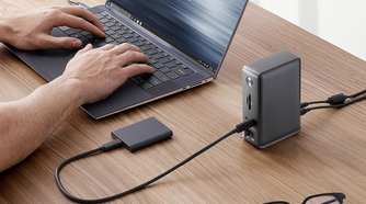 Anker 575 docking station on table plugged into portable SSD