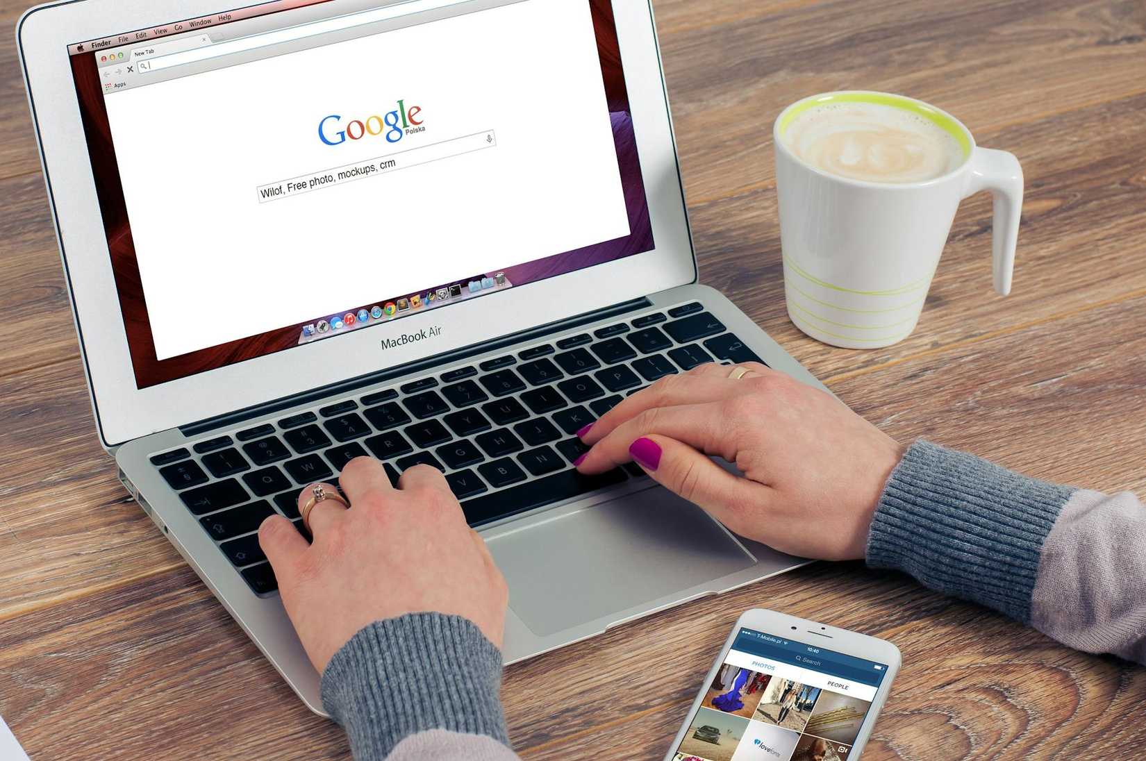 Person using Google search on laptop