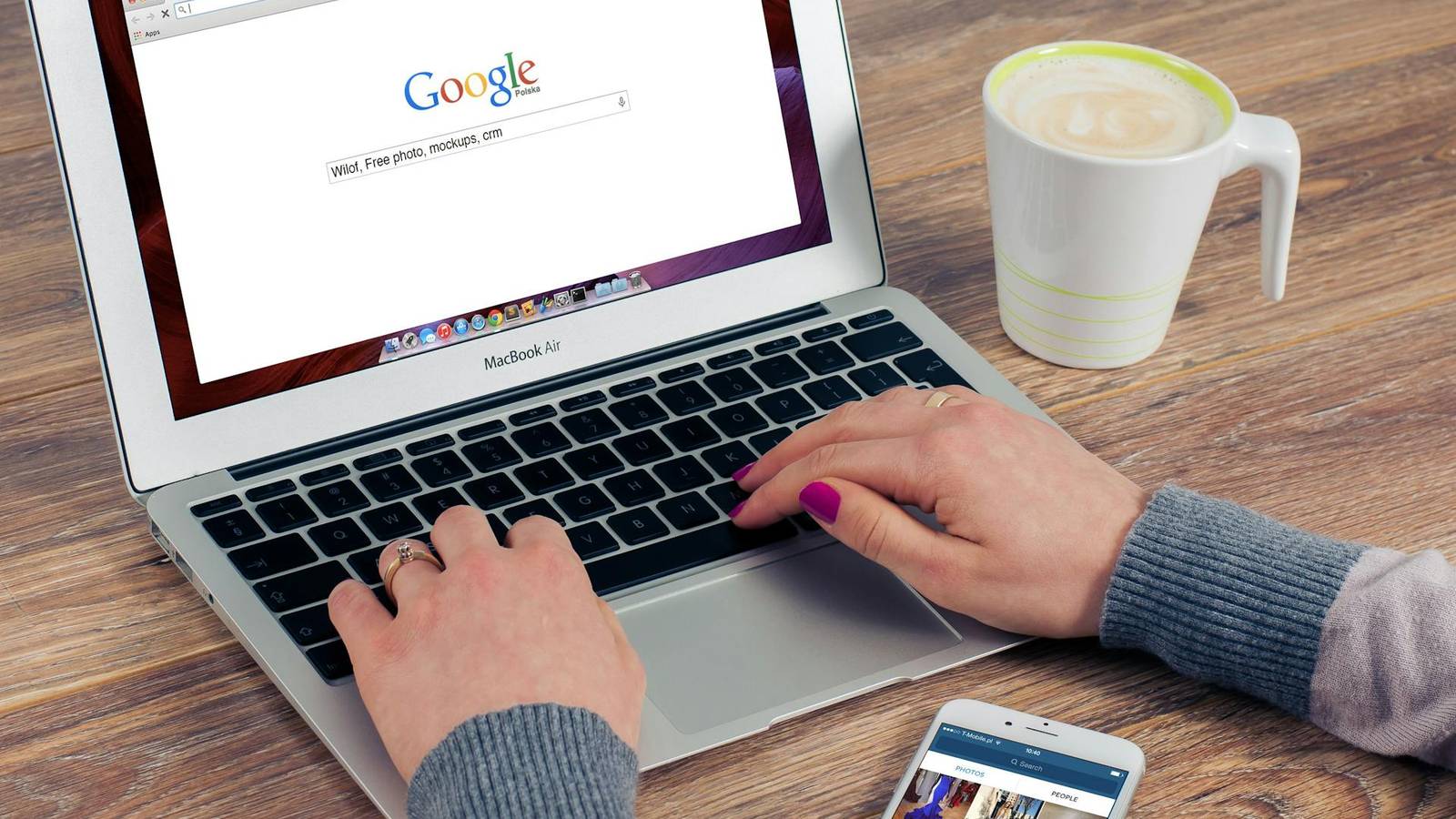Person using Google search on laptop