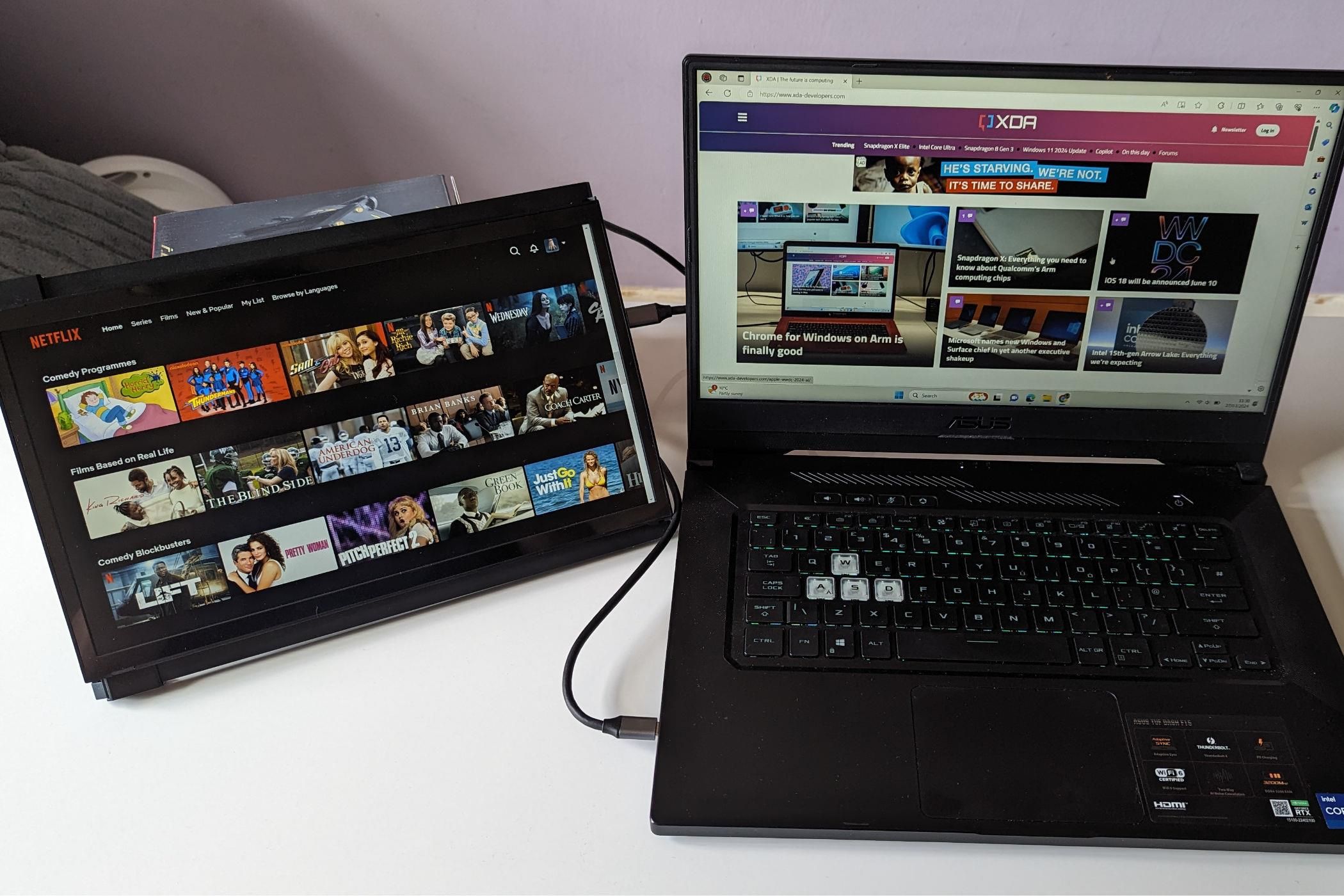 portable monitor showing netflix while laptop shows XDA website