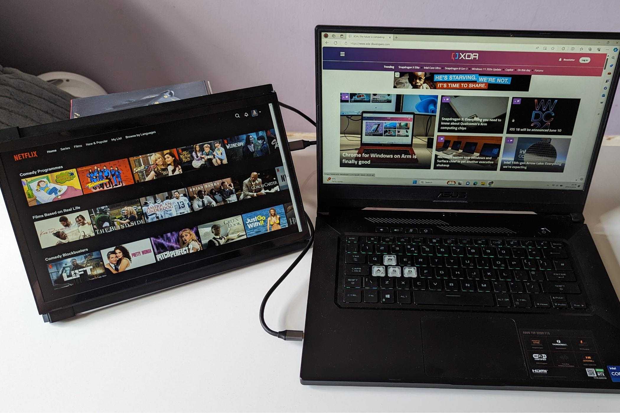 portable monitor showing netflix while laptop shows XDA website