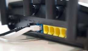 Asus RT-AX57 Ethernet ports and antennas from an angle