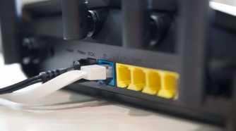 Asus RT-AX57 Ethernet ports and antennas from an angle