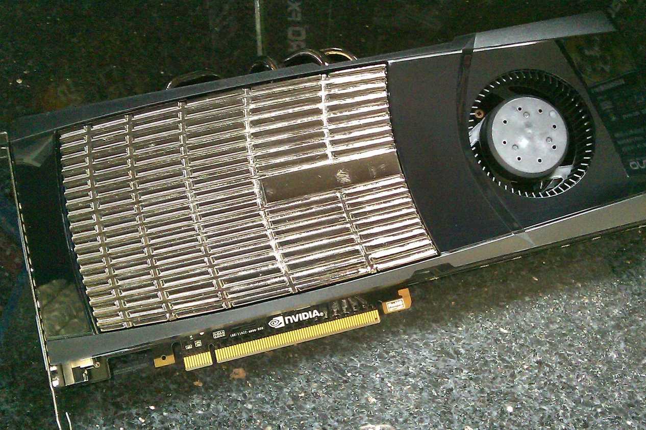 An image showing an Nvidia GTX 480 GPU kept on a deskmat.
