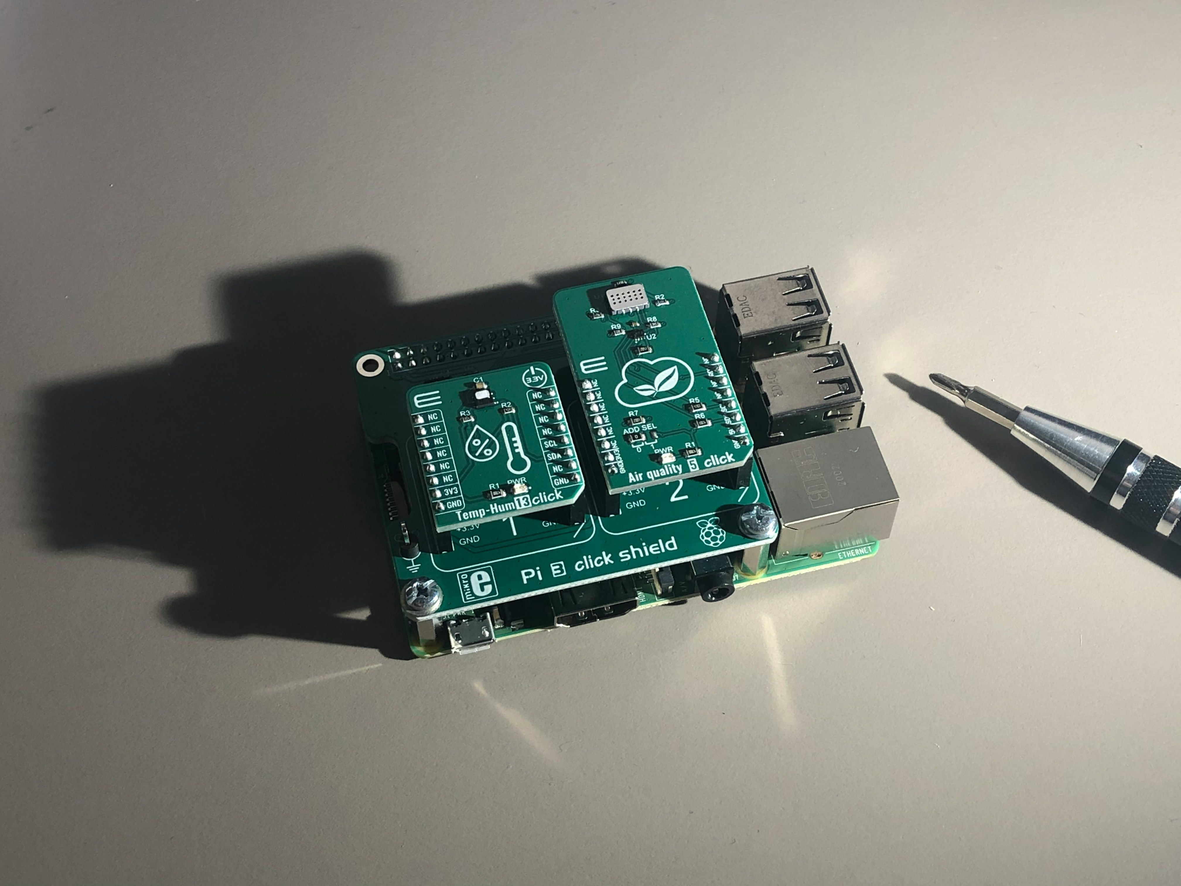 A Raspberry Pi with addon boards attached.