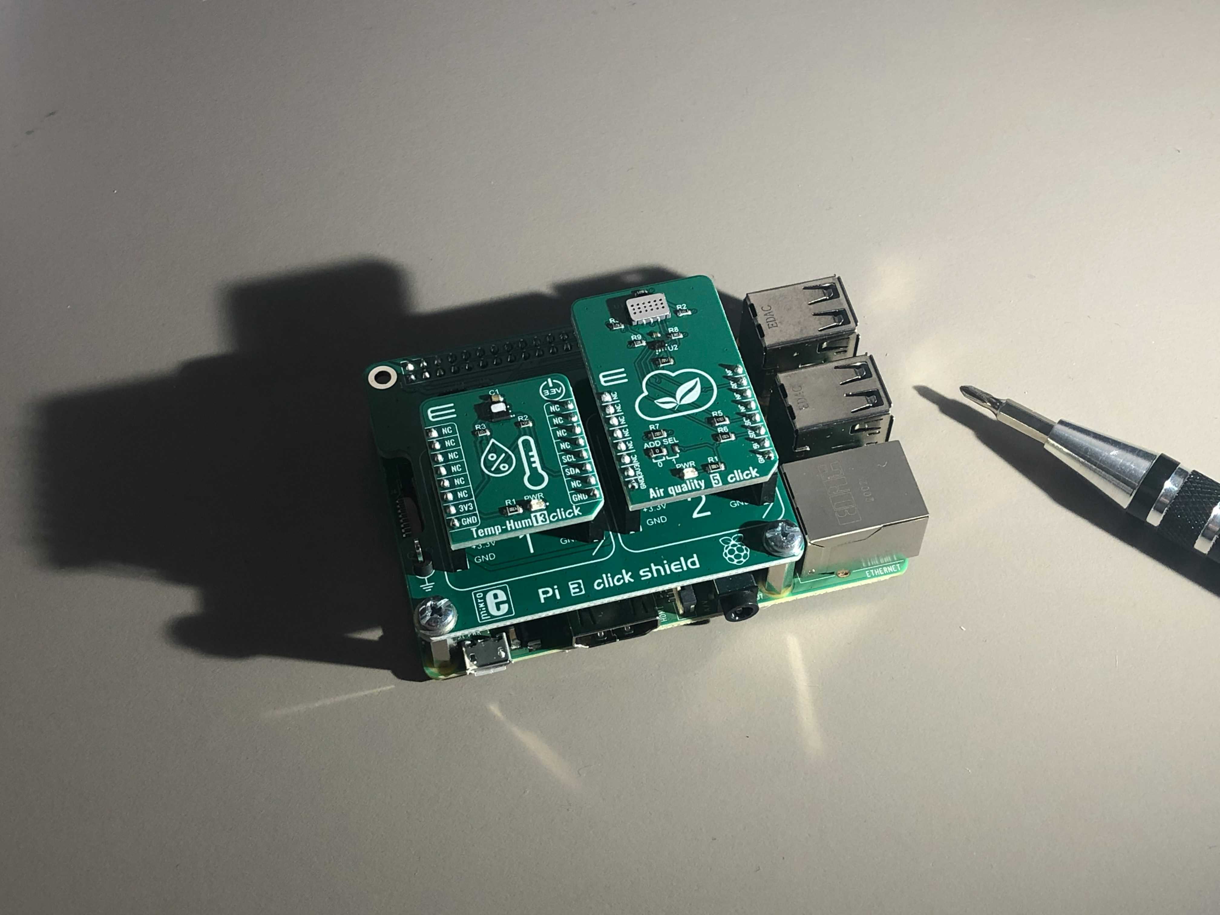 A Raspberry Pi with addon boards attached.