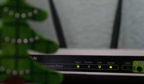 A router in the home with all the lights on