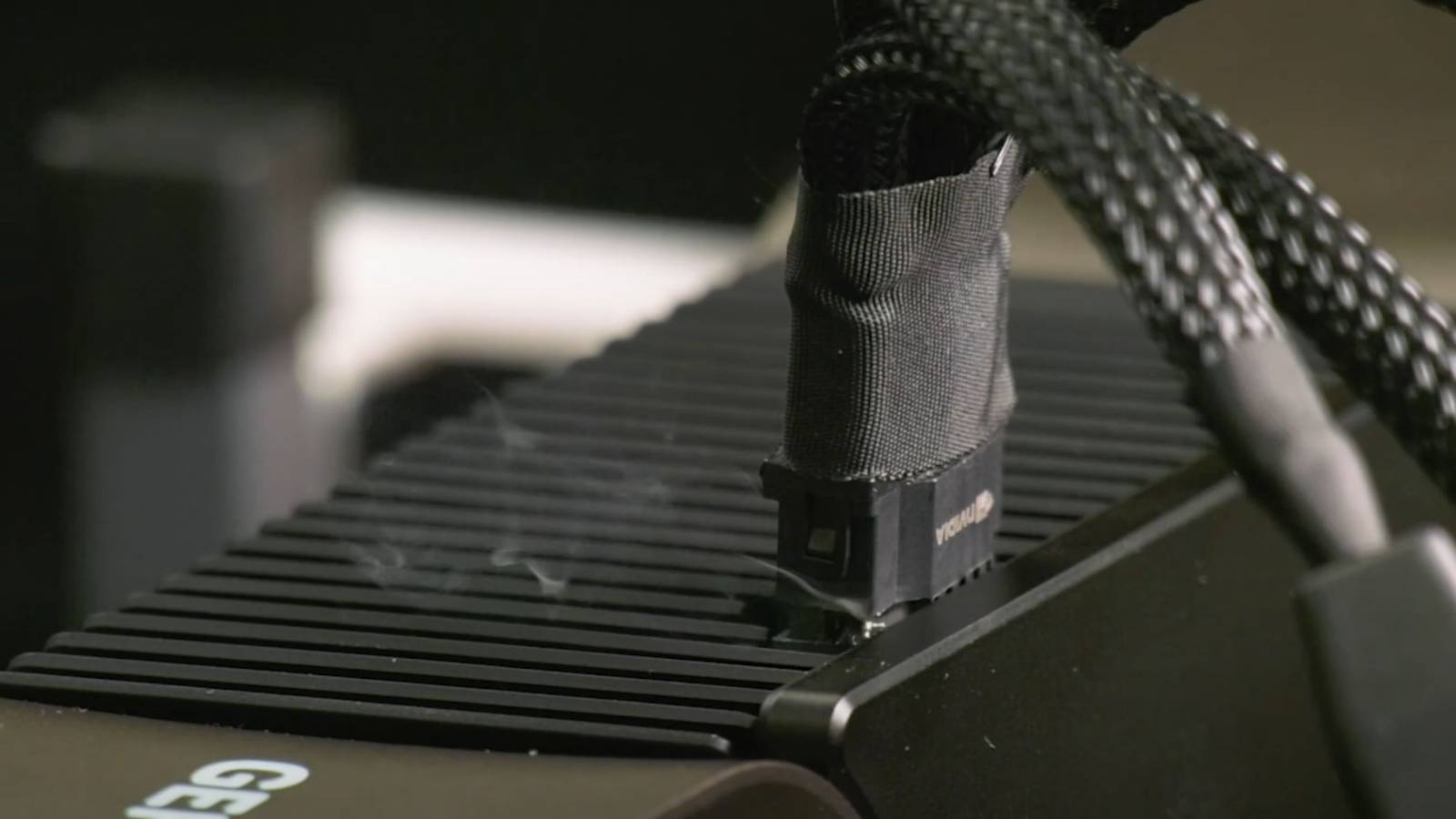 A screenshot showing a fumes coming out of an Nvidia RTX 4090's 12VPWR connector.