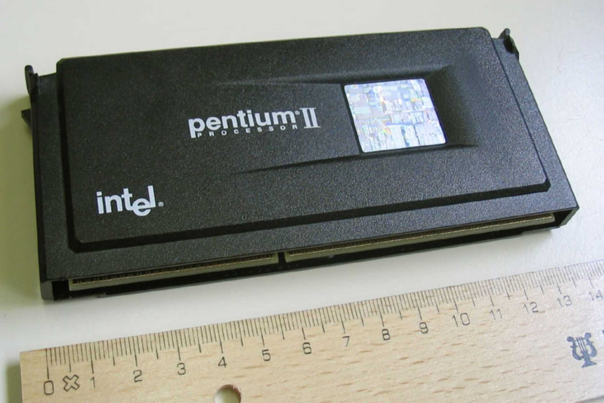 An image showing a Pentium II slot CPU kept next to a ruler for scale.