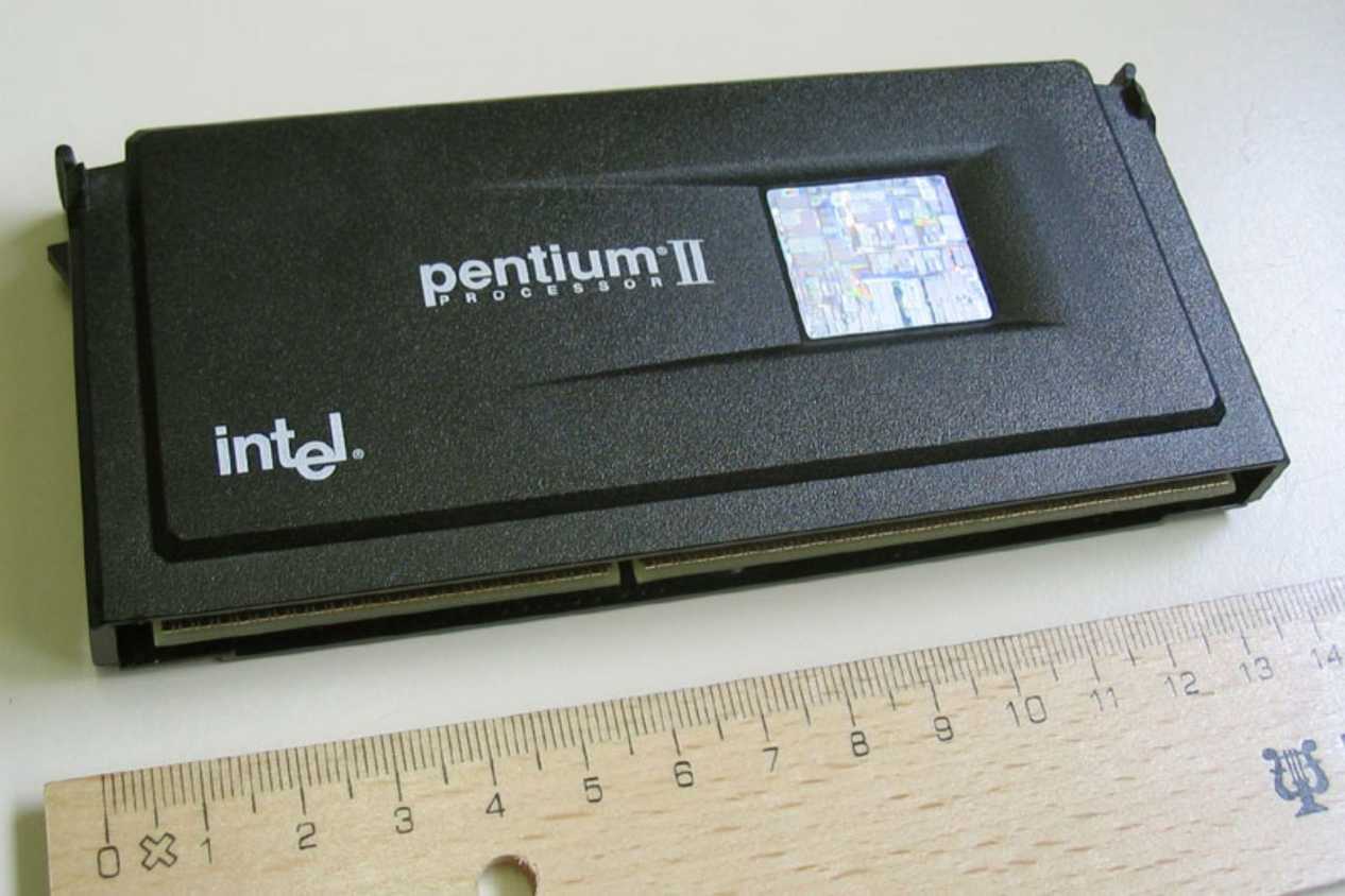 An image showing a Pentium II slot CPU kept next to a ruler for scale.