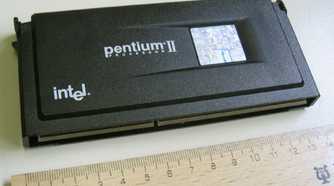 An image showing a Pentium II slot CPU kept next to a ruler for scale.
