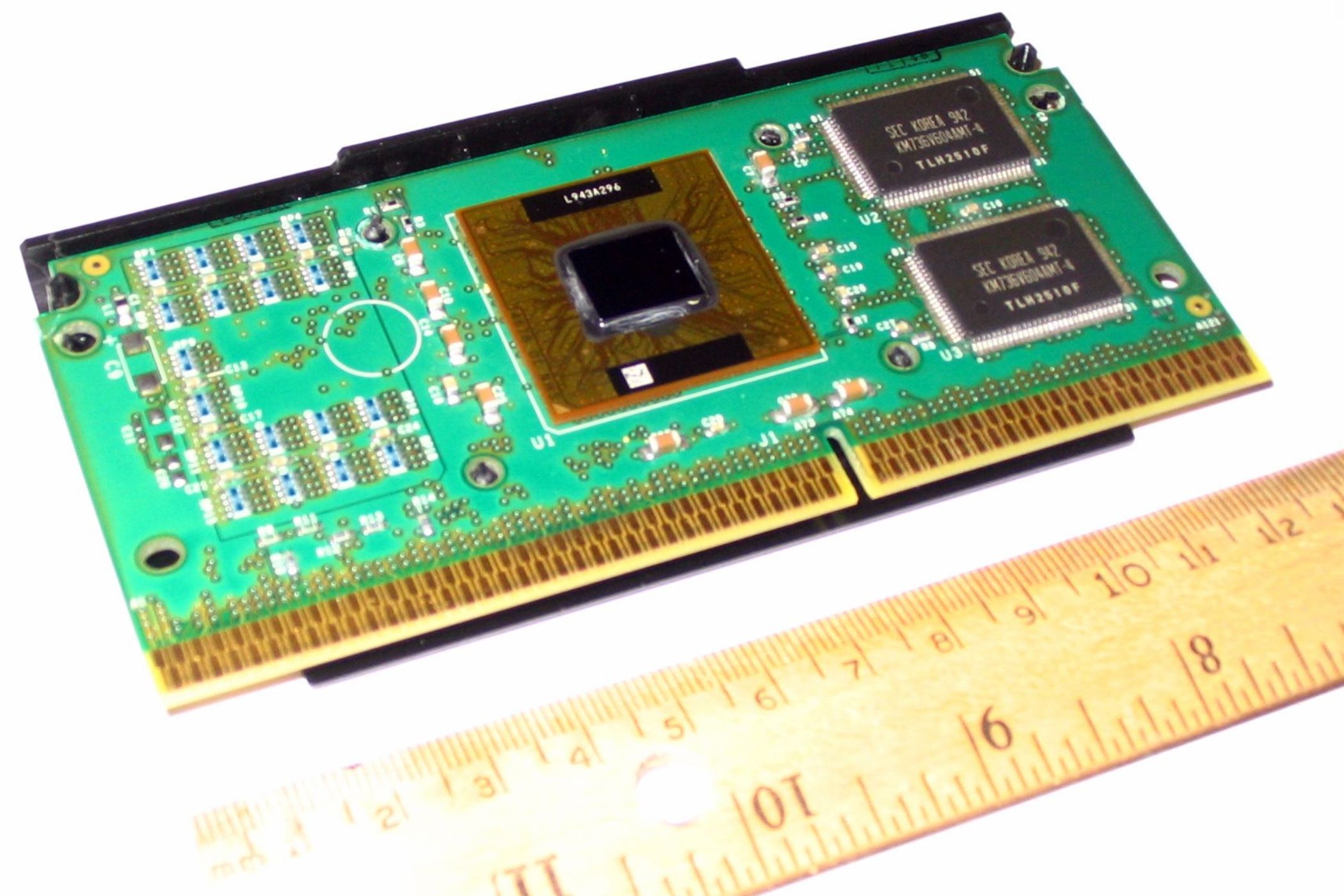 An image showing a Pentium III (Katmai) processor kept on a table next to a ruler.