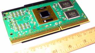 An image showing a Pentium III (Katmai) processor kept on a table next to a ruler.