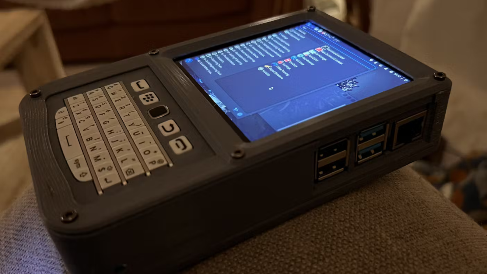 Pi Pocket Computer This Pi-powered pocket PC features a Blackberry keyboard and trackpad