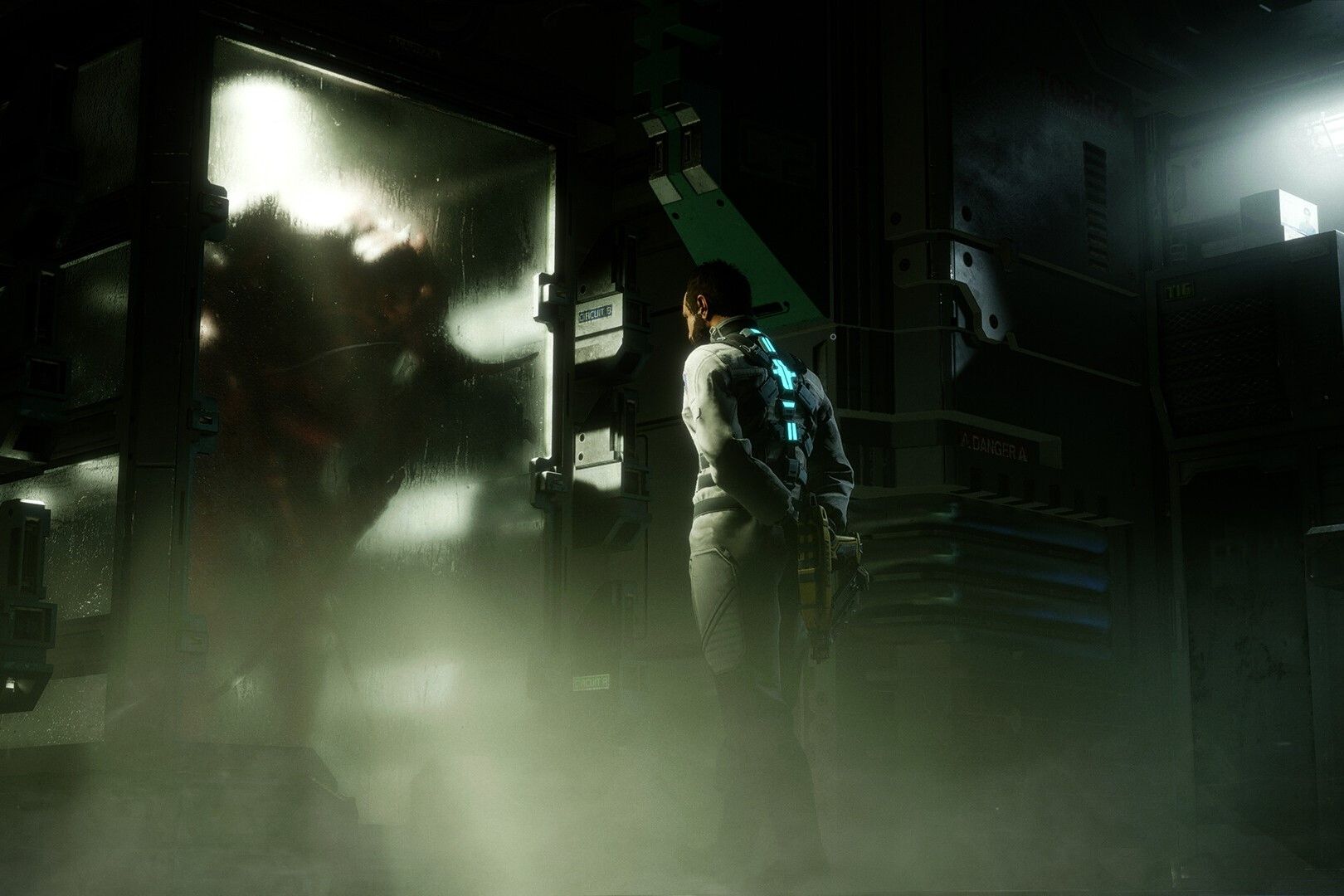 Screenshot from Dead Space 2023 showing a person staring at a glass container