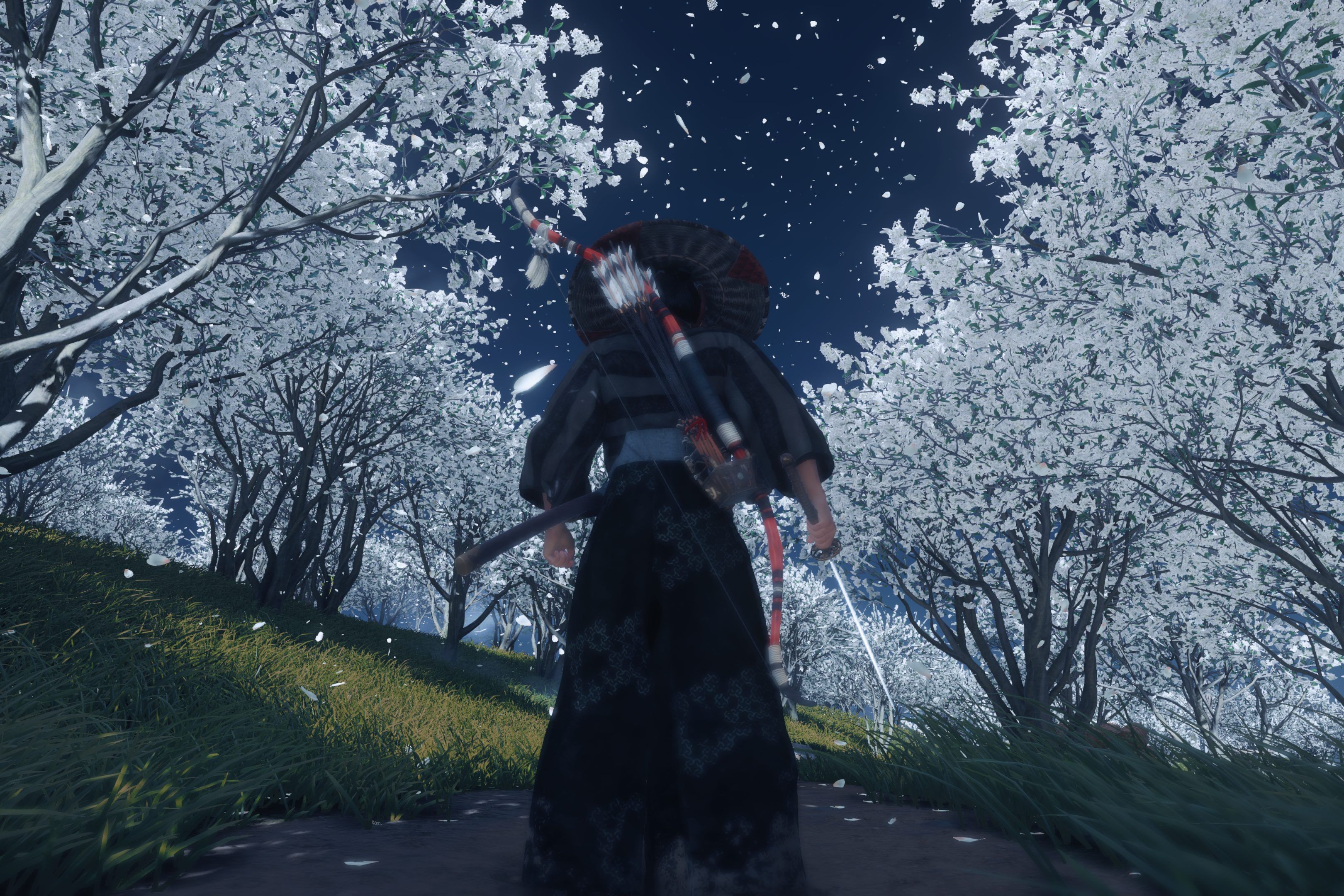Screenshot from Ghost of Tsushima showing Jin standing among white trees