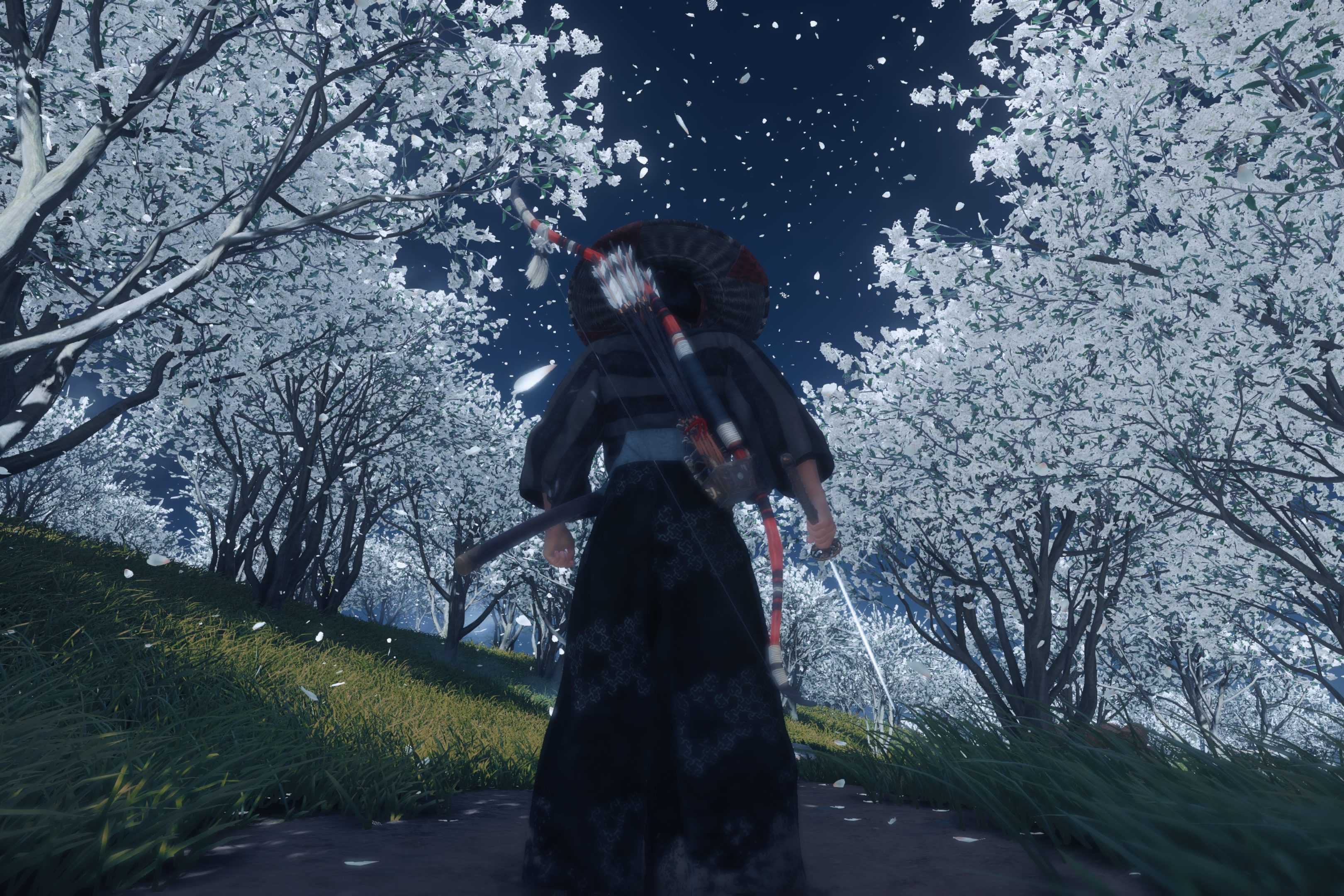 Screenshot from Ghost of Tsushima showing Jin standing among white trees