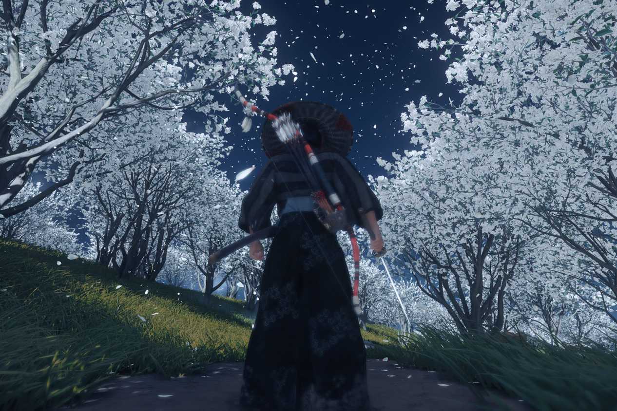 Screenshot from Ghost of Tsushima showing Jin standing among white trees