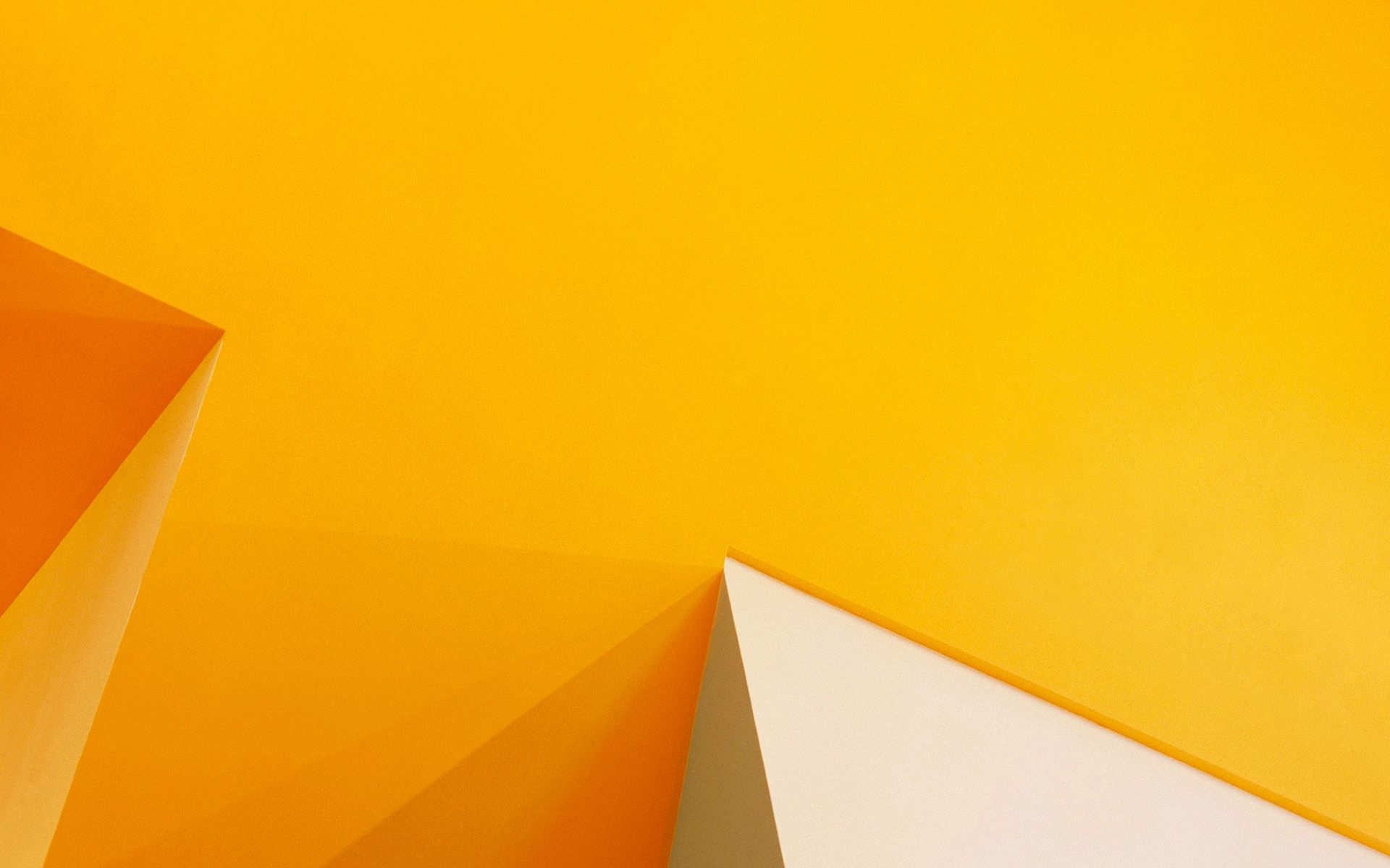 Abstract geometric wallpaper in yellow and cream colors