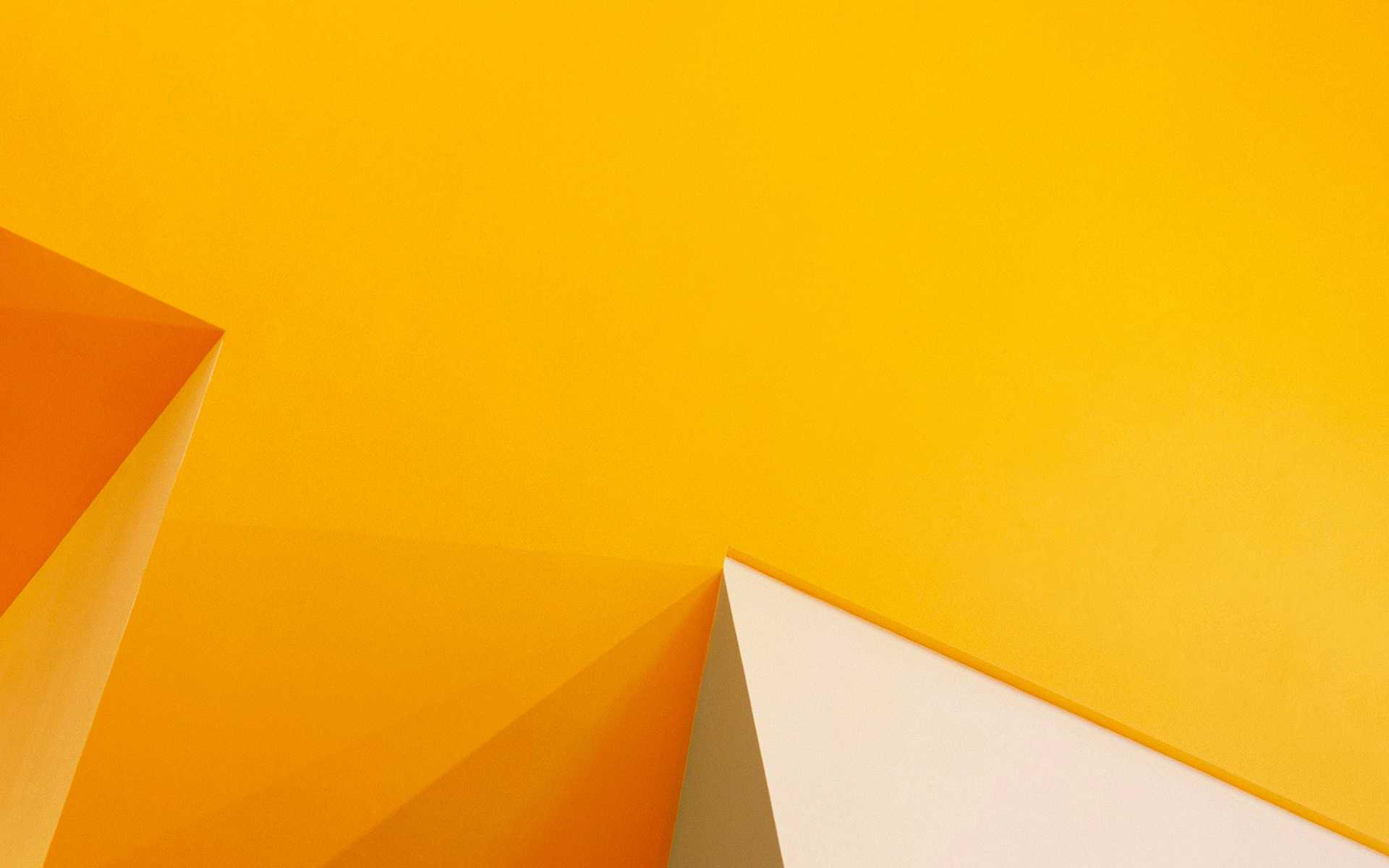 Abstract geometric wallpaper in yellow and cream colors