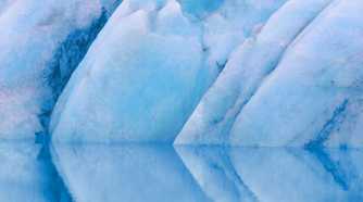 A black of ice on water