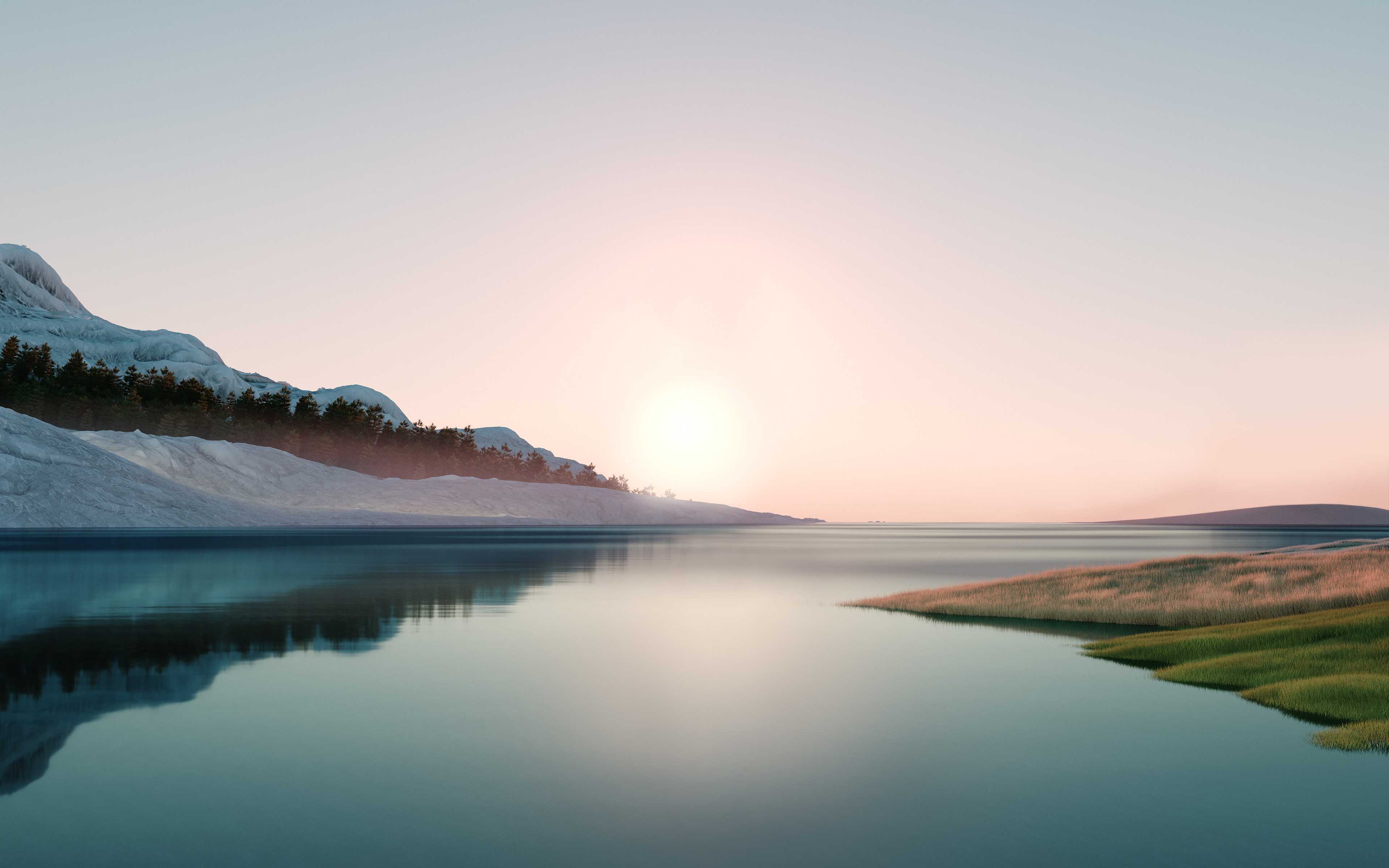 A lake with the sun rising behind the mountains