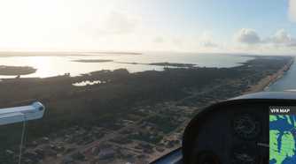 Screenshot from Microsoft Flight Simulator 2020 showing the coast and water reflections