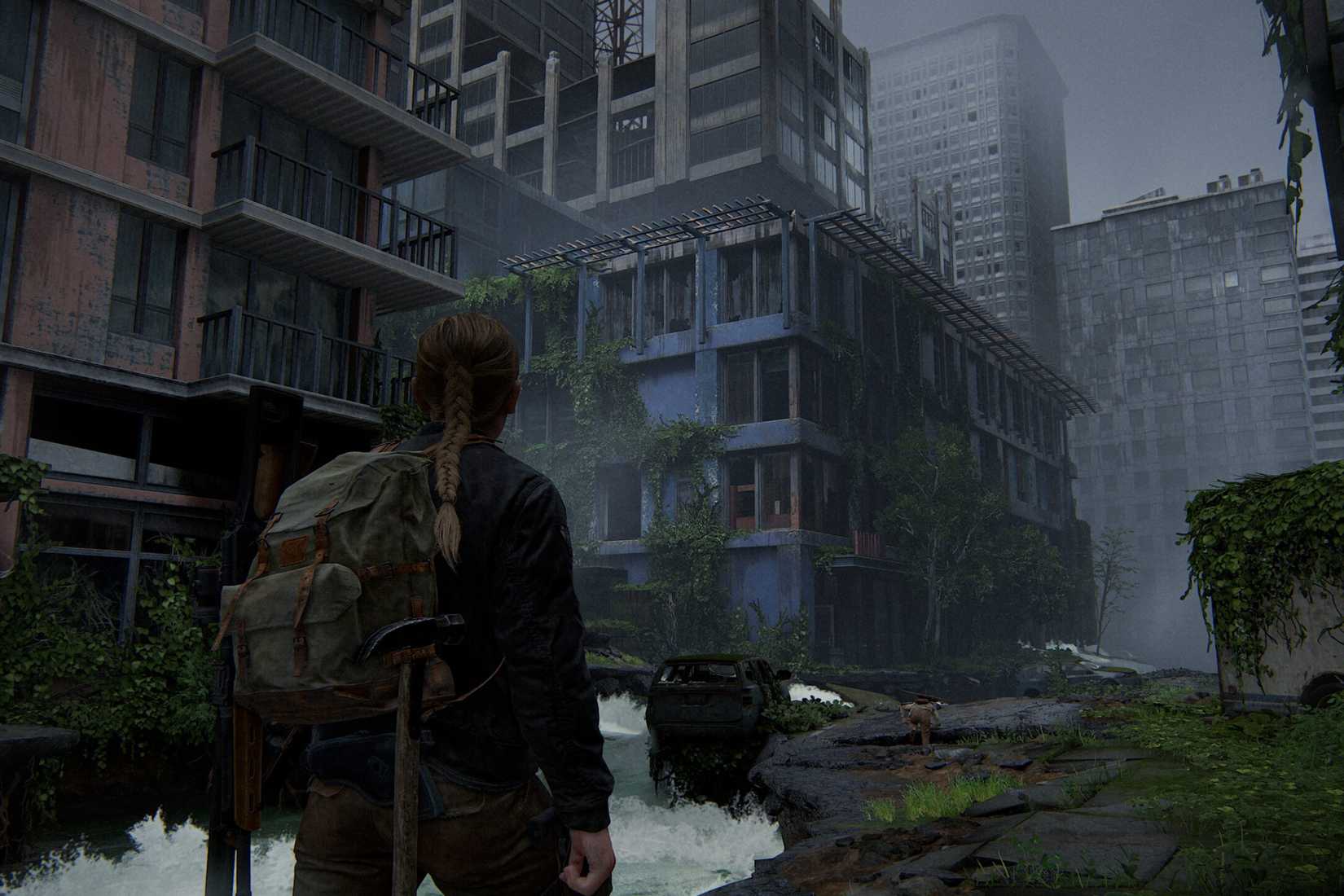 Screenshot from The Last of Us Part II showing Abby walking through the city