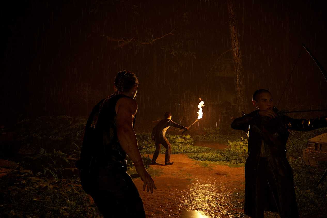 three characters walking in the jungle by firelight
