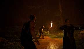 three characters walking in the jungle by firelight