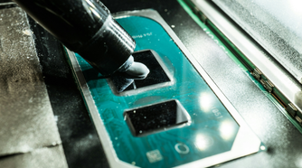 Someone applying thermal paste
