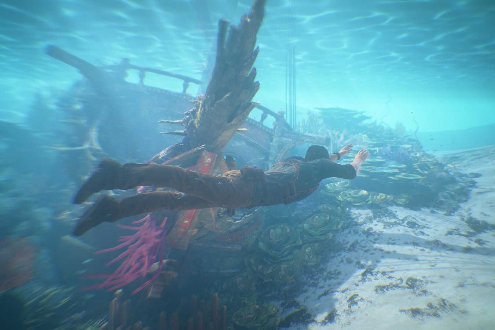 Screenshot of Uncharted 4 showing Nate swimming underwater