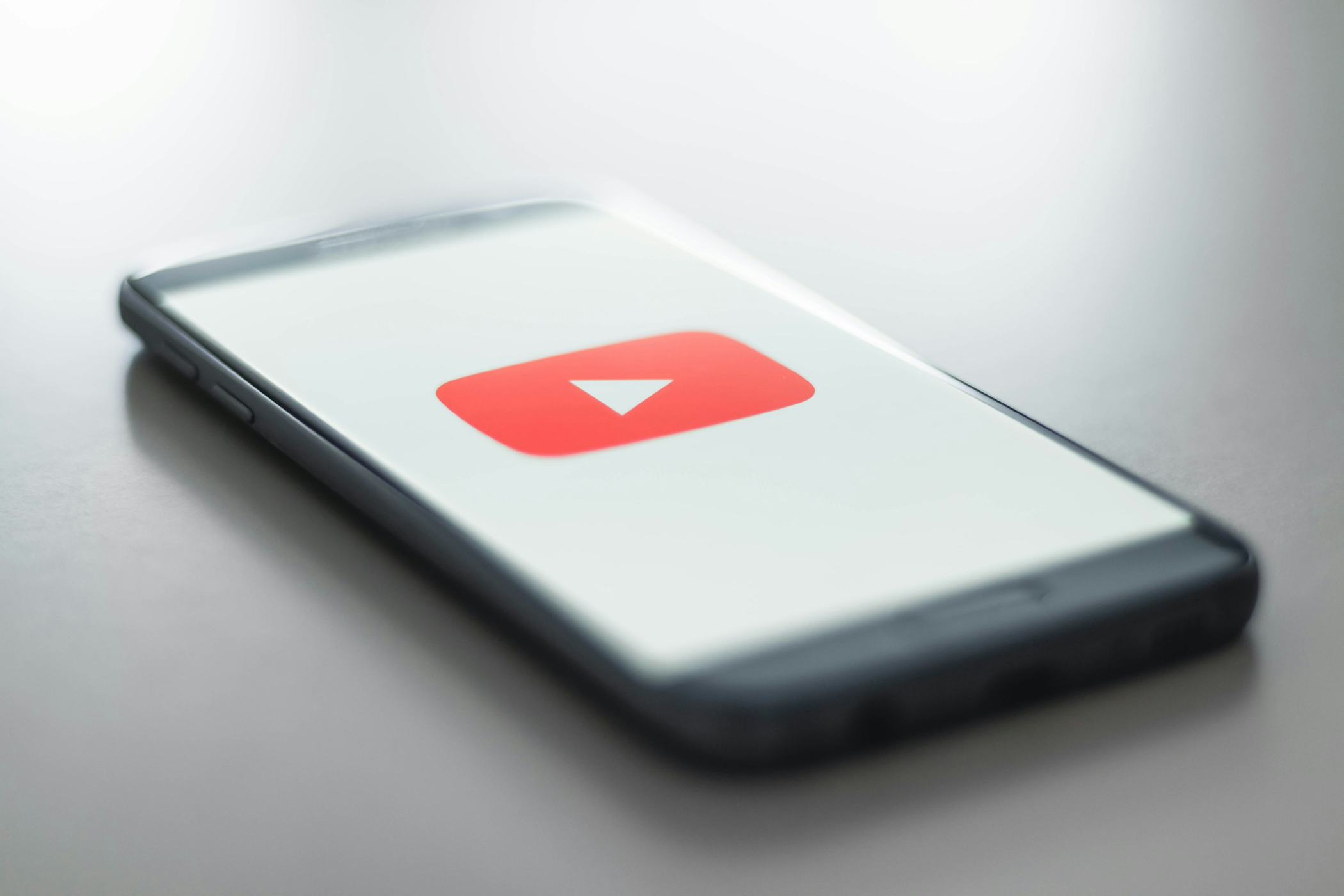The YouTube logo on a phone