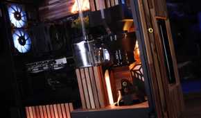 An image showing a close up of a coffee machine that's built inside a PC case