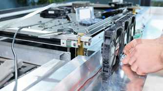 An image showing a person assembling a heatsink and fan assembly