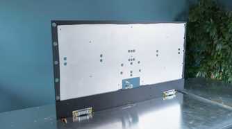 An image showing an aluminum piece cut out standing on another aluminum sheet