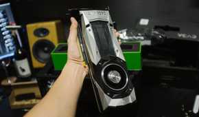 Person holding a GTX 1070 founder's edition graphics card